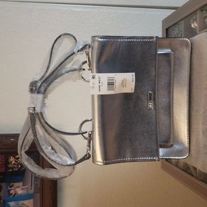 Nine West- New silver metallic hand bag/crossover straps.New never used.